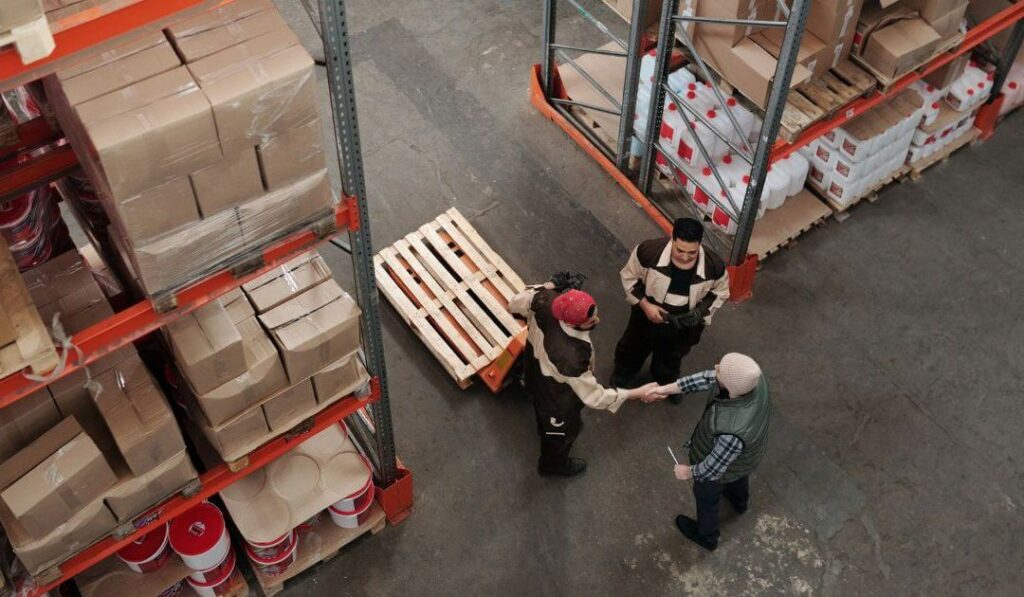 Employees standing around a warehouse