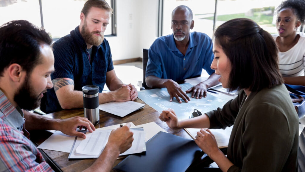 Group of five working together